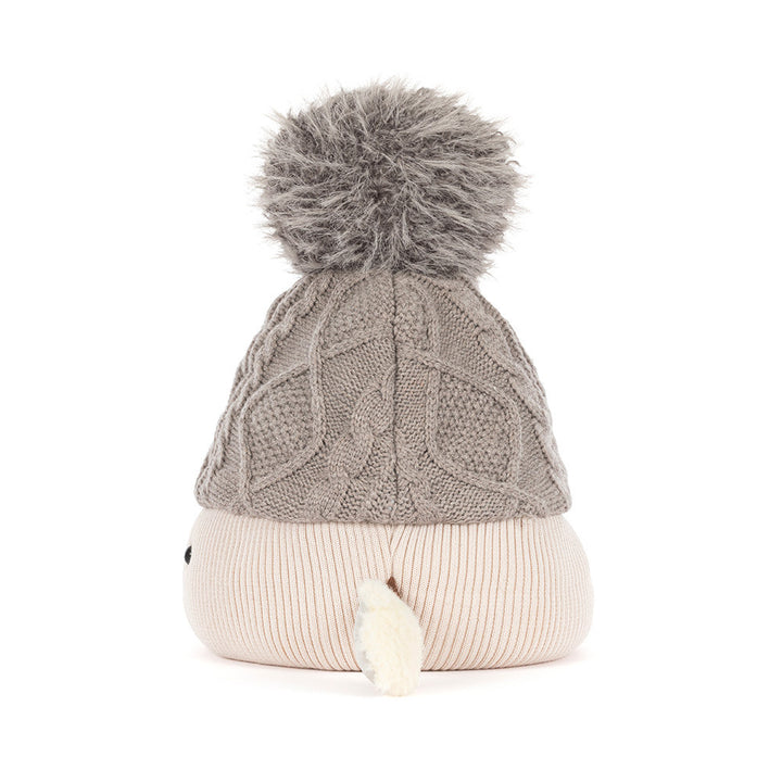 Side profile of Jellycat Amuseables Pomilly, a soft Christmas party hat plush stocking stuffer