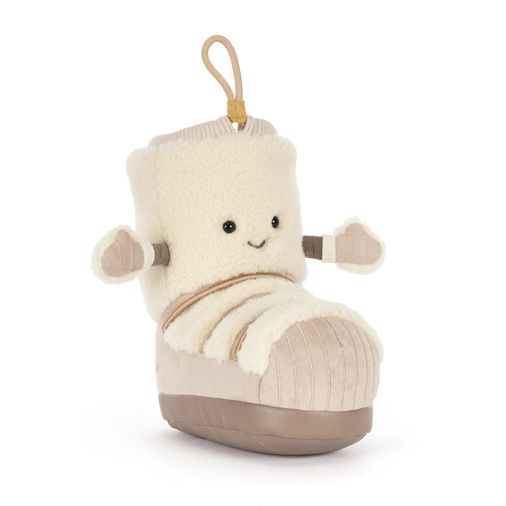 Angled view of Perta Snow Boot, Jellycat's plush lace-up boot for holiday shelf displays