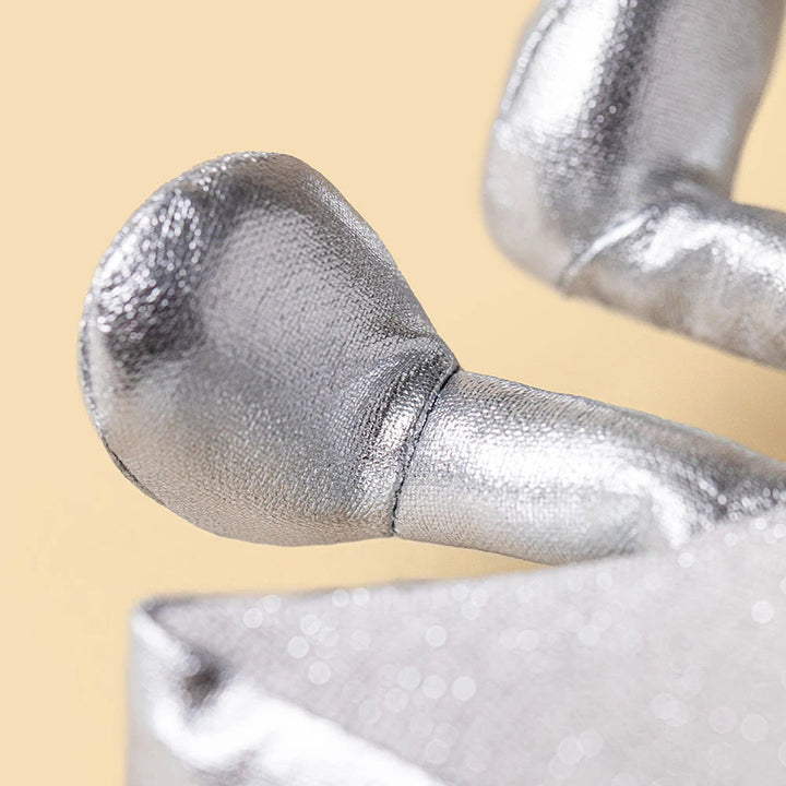 Close-up of Silver Star's cheerful face, a Jellycat Amuseables sparkly Christmas plush toy