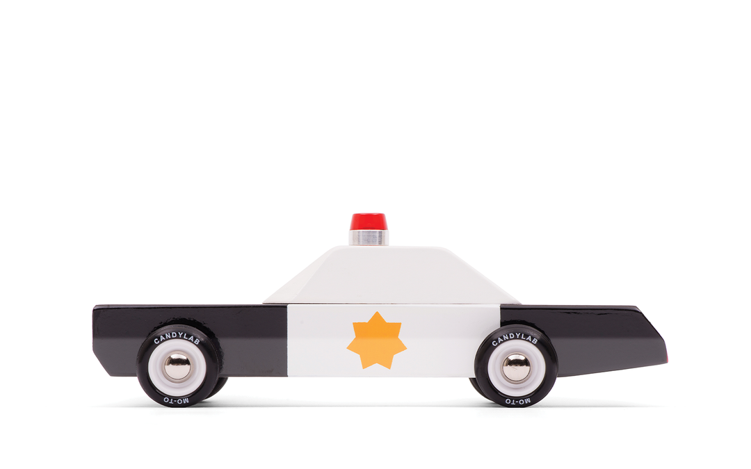 Plantoys Police Cruiser shown in a crisp side angle, designed as a classic police car toy for imaginative play.