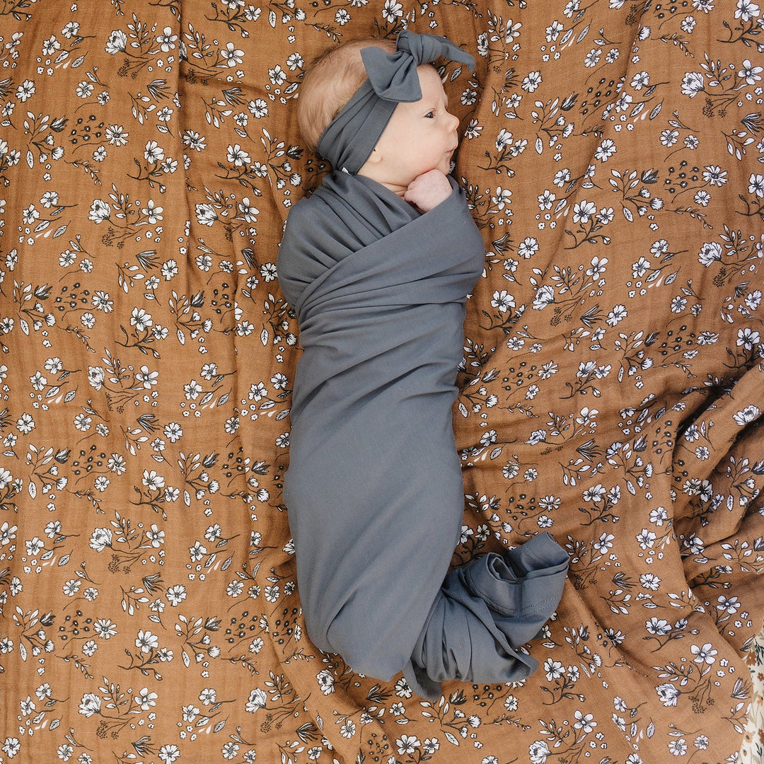 Mebie Baby Charcoal Bamboo Stretch Swaddle keeps your newborn wrapped in comfort as the best baby swaddle.