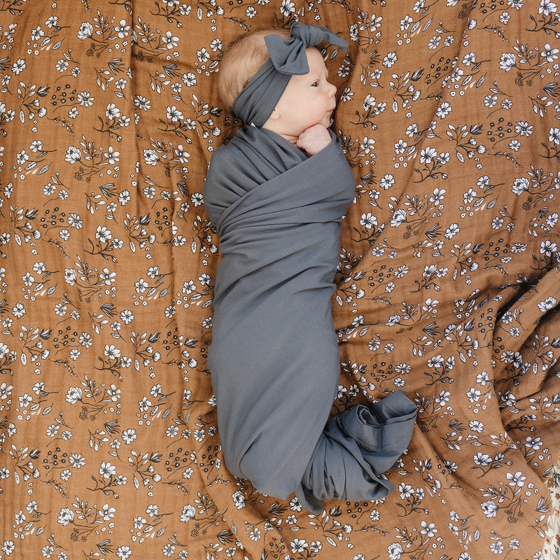 Mebie Baby Charcoal Bamboo Stretch Swaddle keeps your newborn wrapped in comfort as the best baby swaddle.