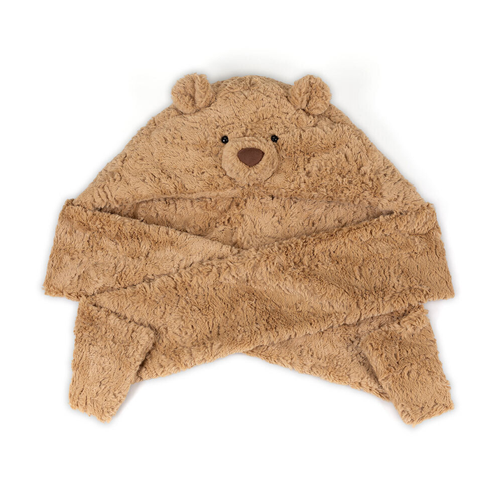 Bartholomew Bear Bundlesnug by Jellycat, styled on model outdoors