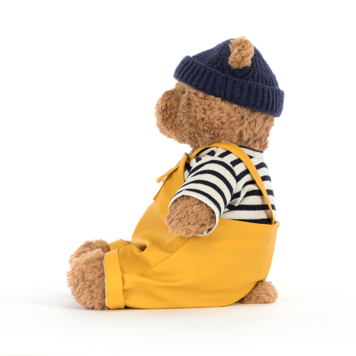 Jellycat Bartholomew Bear Fisherman close-up -- BARM2FM podgy fudge-colored bear plush with fisherman hat and outfit detail, soft cuddly teddy bear gift for Jellycat fans
