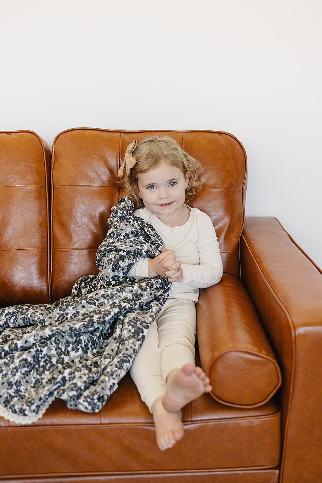 Lightweight and soft, the Liberty Floral + Coastal Plaid Lace Muslin Quilt is a versatile muslin baby blanket by Mebie Baby.