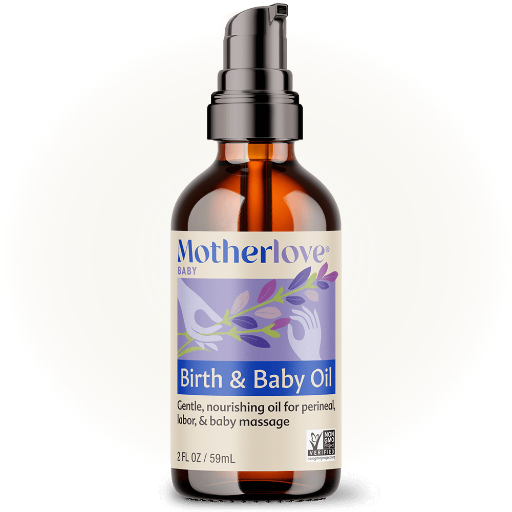 Glowing in soft light, the Motherlove Birth & Baby Oil highlights its gentle blend of essential oils for birth and natural comfort.