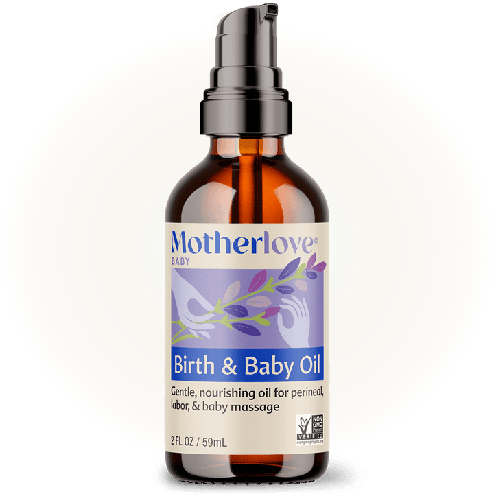 Glowing in soft light, the Motherlove Birth & Baby Oil highlights its gentle blend of essential oils for birth and natural comfort.