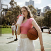 girl holding basketball and b.box flip top bottle in pink paradise