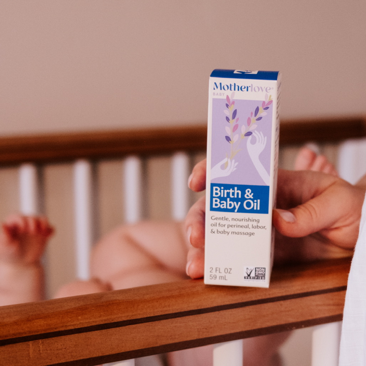 Flat-lay view of Motherlove Birth & Baby Oil, a nourishing formula perfect for gentle perineal care and natural baby oil massage.