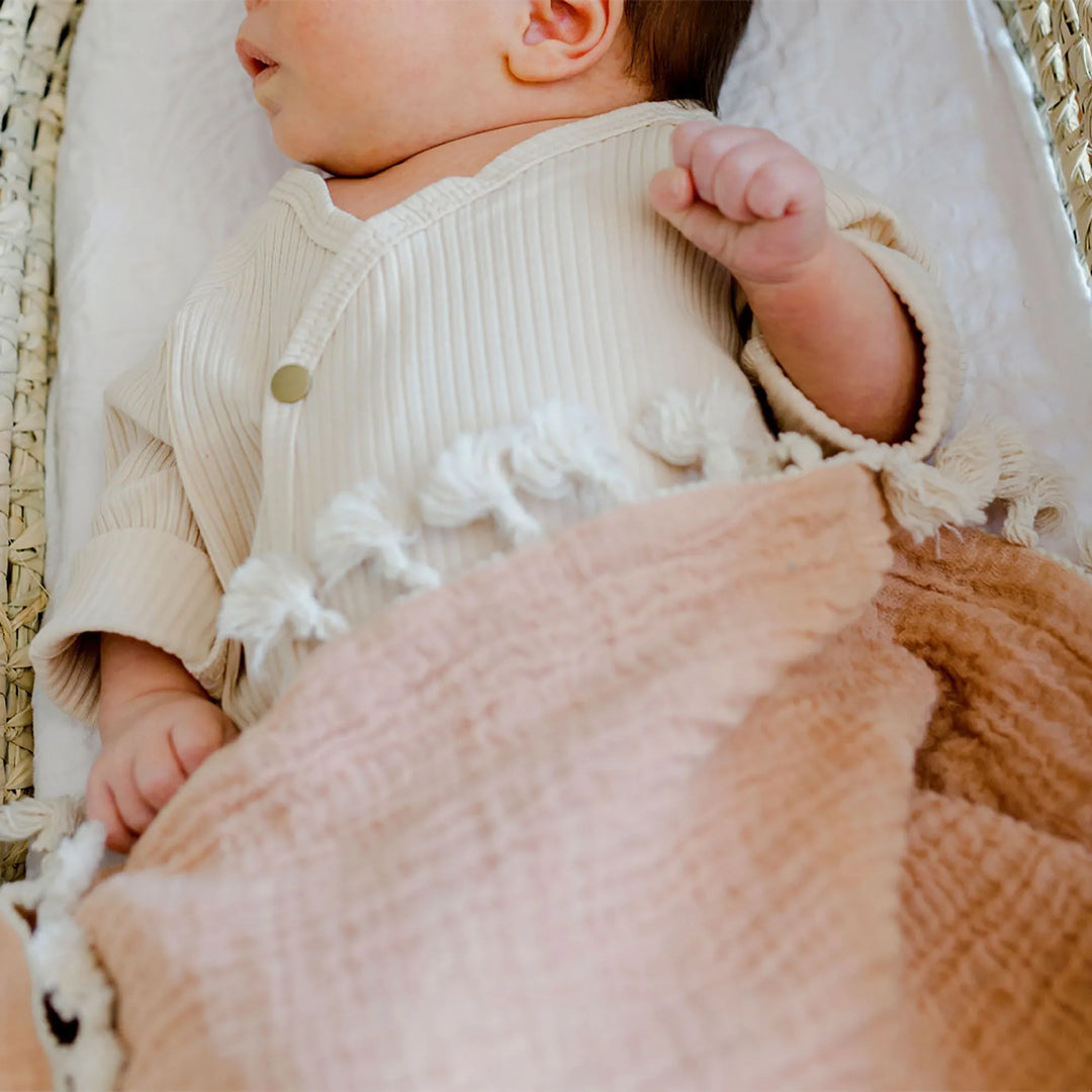 Cuddly and chic Crane Baby 6 Layer Muslin Blanket in Copper, a soft muslin baby blanket ideal for newborns and toddlers.