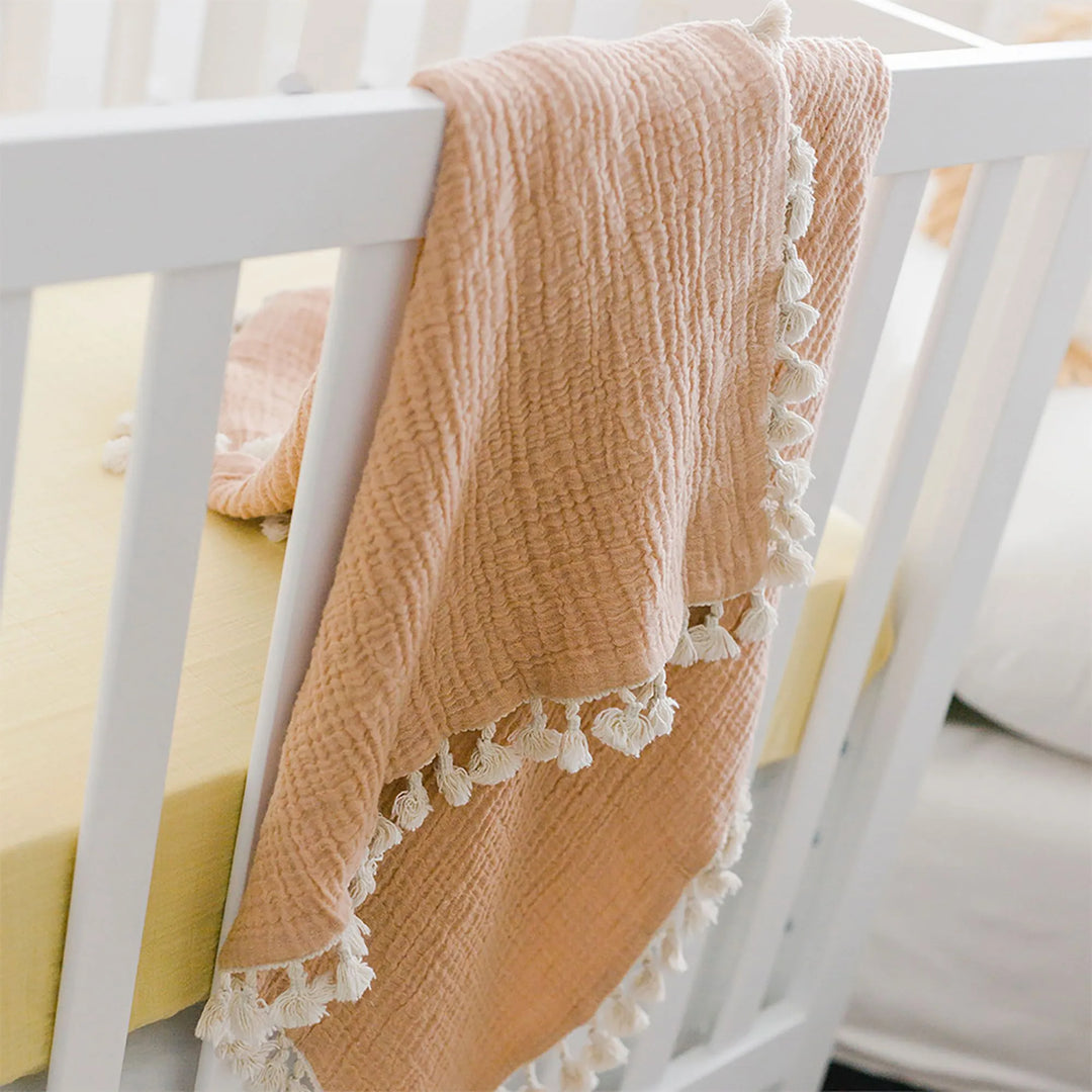 Crane Baby 6 Layer Muslin Blanket in Copper provides gentle comfort, a muslin baby blanket ideal for snuggles and tummy time.