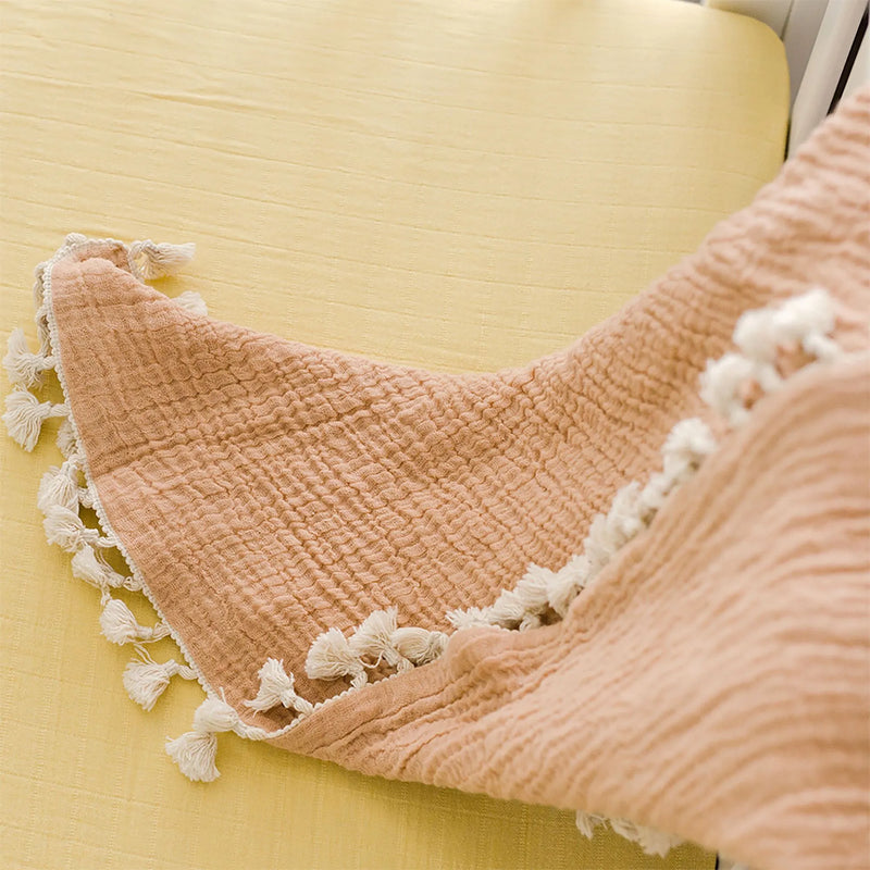 Lightweight and cozy Crane Baby 6 Layer Muslin Blanket Copper, one of the best muslin blankets for babies and toddlers.