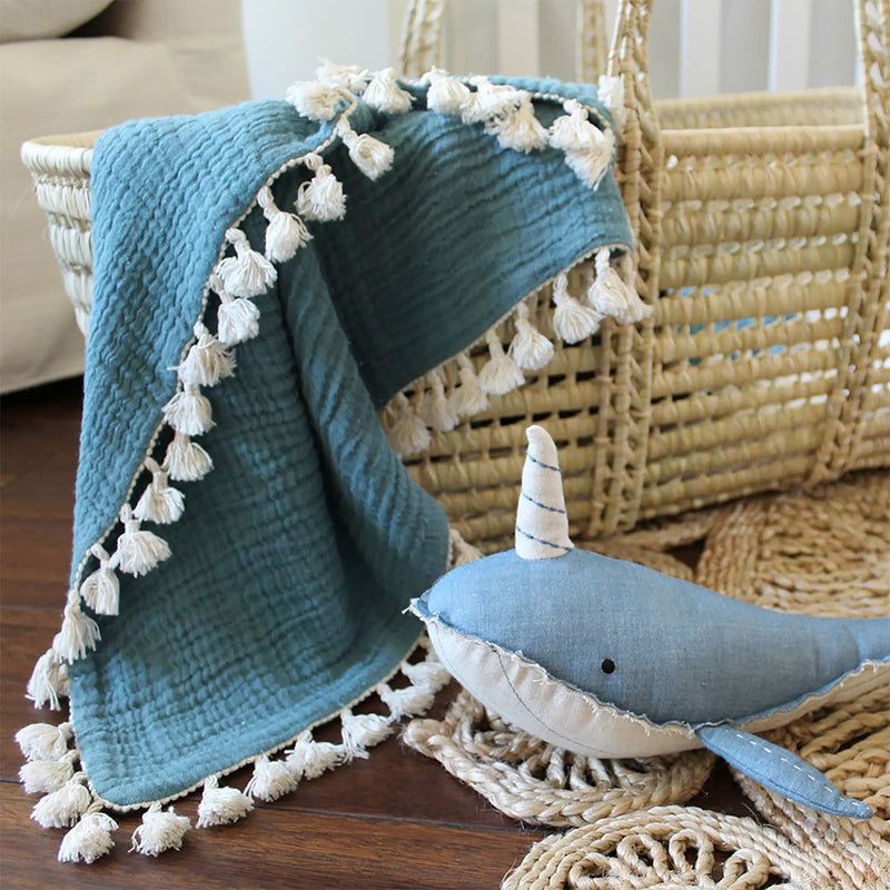 Wrap your little one in the Crane Baby 6 Layer Muslin Blanket Riverstone, a versatile baby blanket for home or travel.