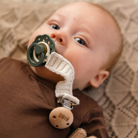 Knitted BIBS Pacifier Clip offers cozy texture for baby pacifier clips.