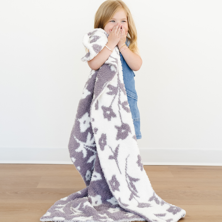 Shown in the color Pansy Purple, the Saranoni Double-Layer BAMBONI¨ Toddler Blankets feel ultra soft baby blankets.