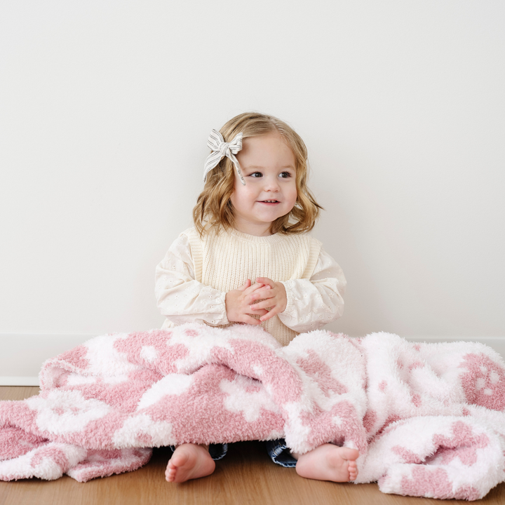 SaranoniÕs BAMBONI¨ Receiving Blanket in Petal delivers warmth and texture, redefining the standard for receiving blankets.