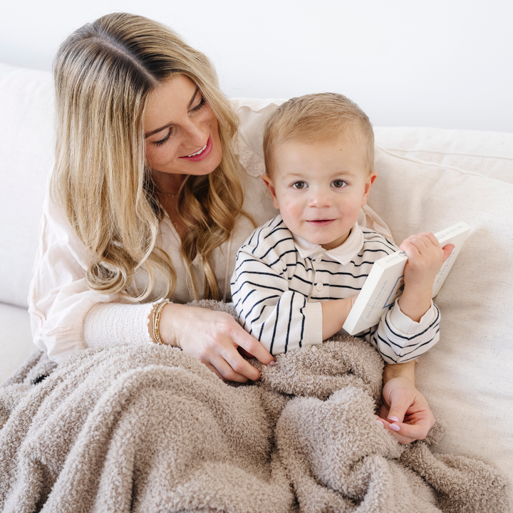 Toddlers love snuggling in the Taupe Saranoni BAMBONI¨ Toddler Blanket, a top baby boy blankets pick.