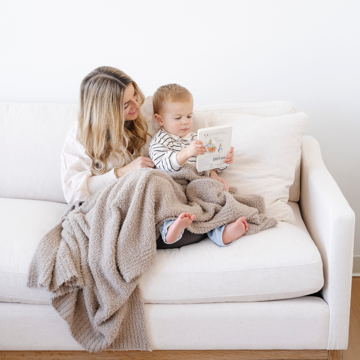 A dreamy Taupe Saranoni BAMBONI¨ Toddler Blanket that works as a plush baby blanket.