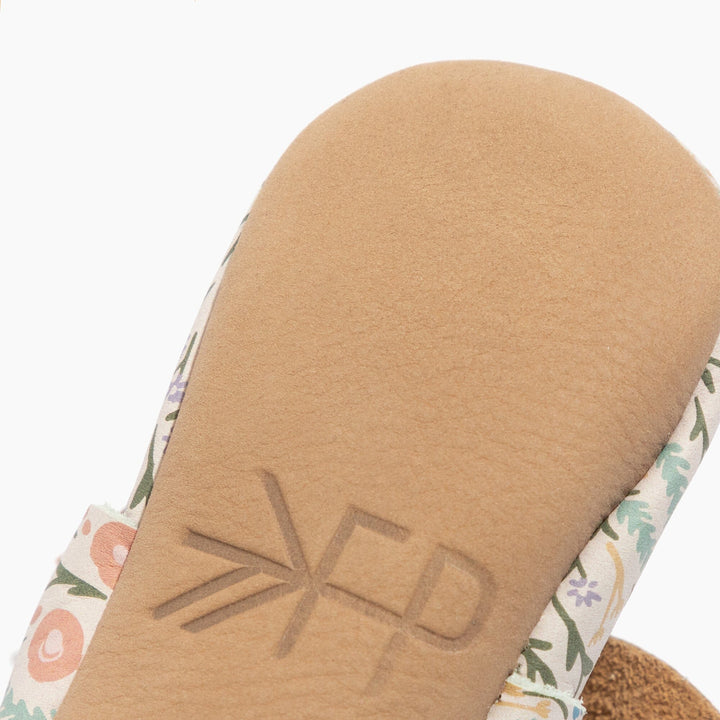 Freshly Picked Bloom Knotted Bow baby shoe sole logo close-up, handmade leather