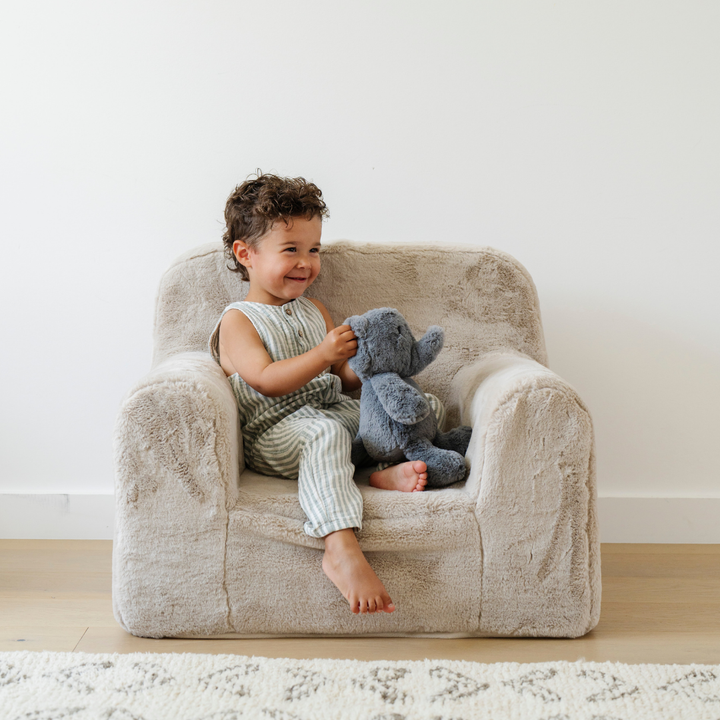 Little ones can rest in Buff Saranoni Snuggle Up Chair, a soft kids chair ideal for storytime.