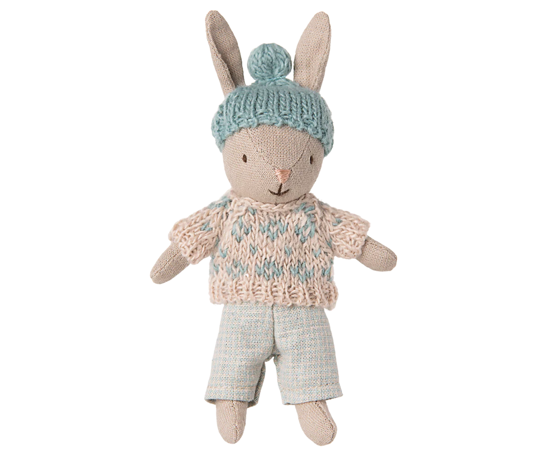 The Maileg Micro Bunny in winter Sand/Mint posed on a playful background, perfect for a doll collection.