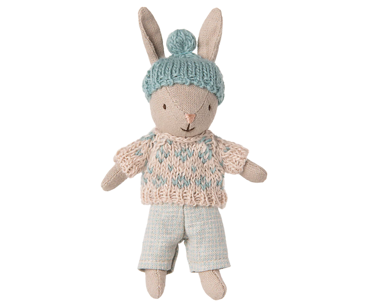 The Maileg Micro Bunny in winter Sand/Mint posed on a playful background, perfect for a doll collection.