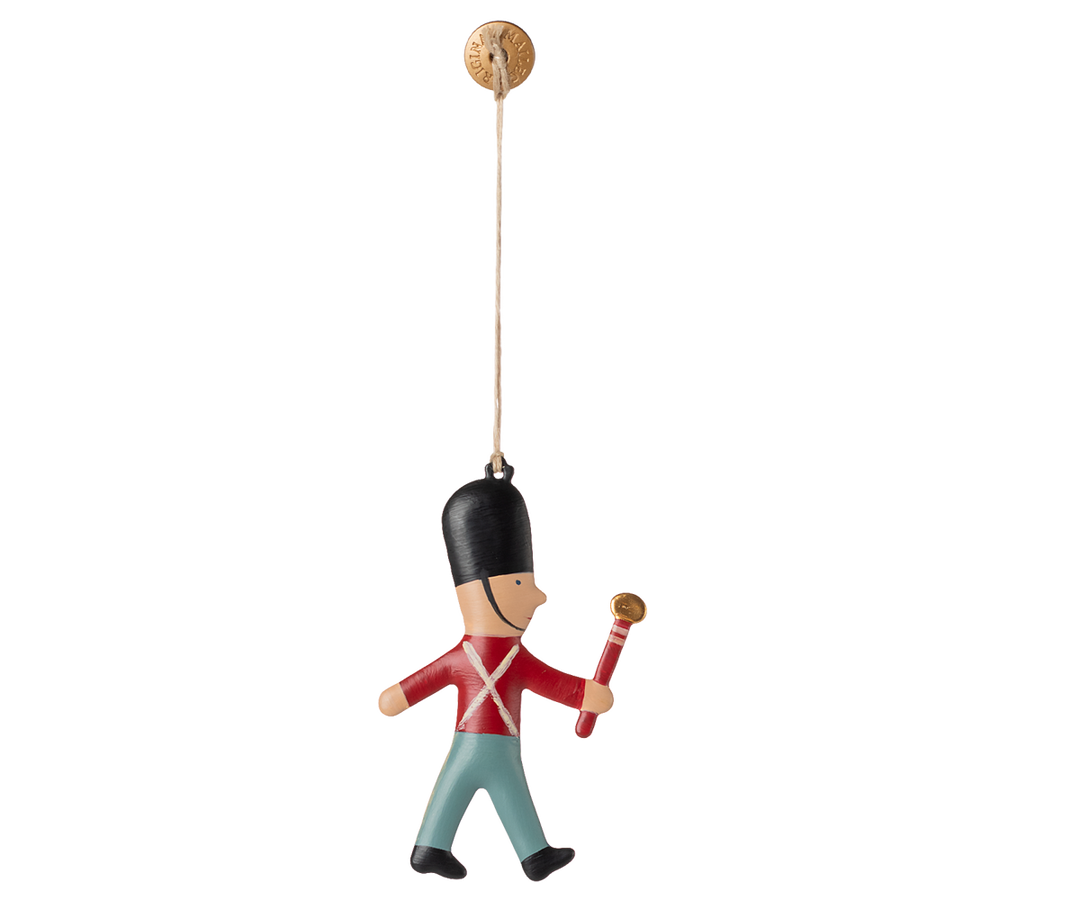 Maileg Guard Metal Ornament with Stick stands proudly, adding festive charm to classic Christmas ornaments.