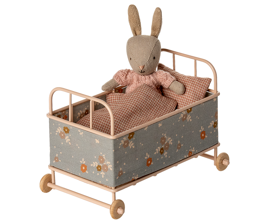 maileg small metal cot with a small bunny inside underneath blanket