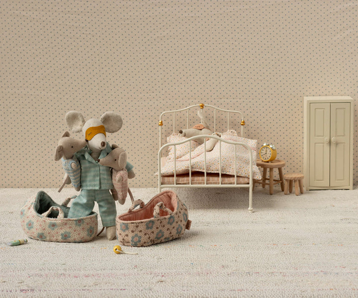 Miniature worlds shine with the Maileg Baby Mouse tucked safely in its Carry Cot.