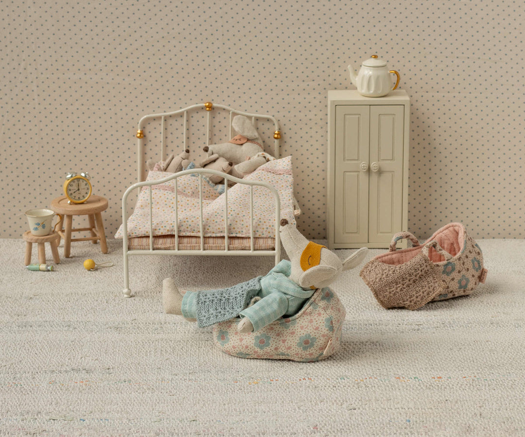 Bringing charm to playtime, this Maileg Mouse Carry Cot offers a snug resting spot for stuffed dolls.