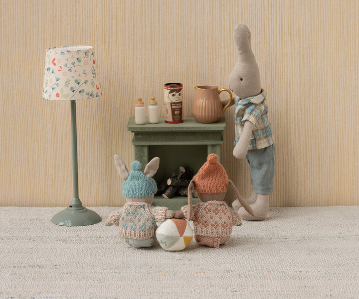 Maileg Micro Bunnies featured in a whimsical scene alongside other stuffed dolls.