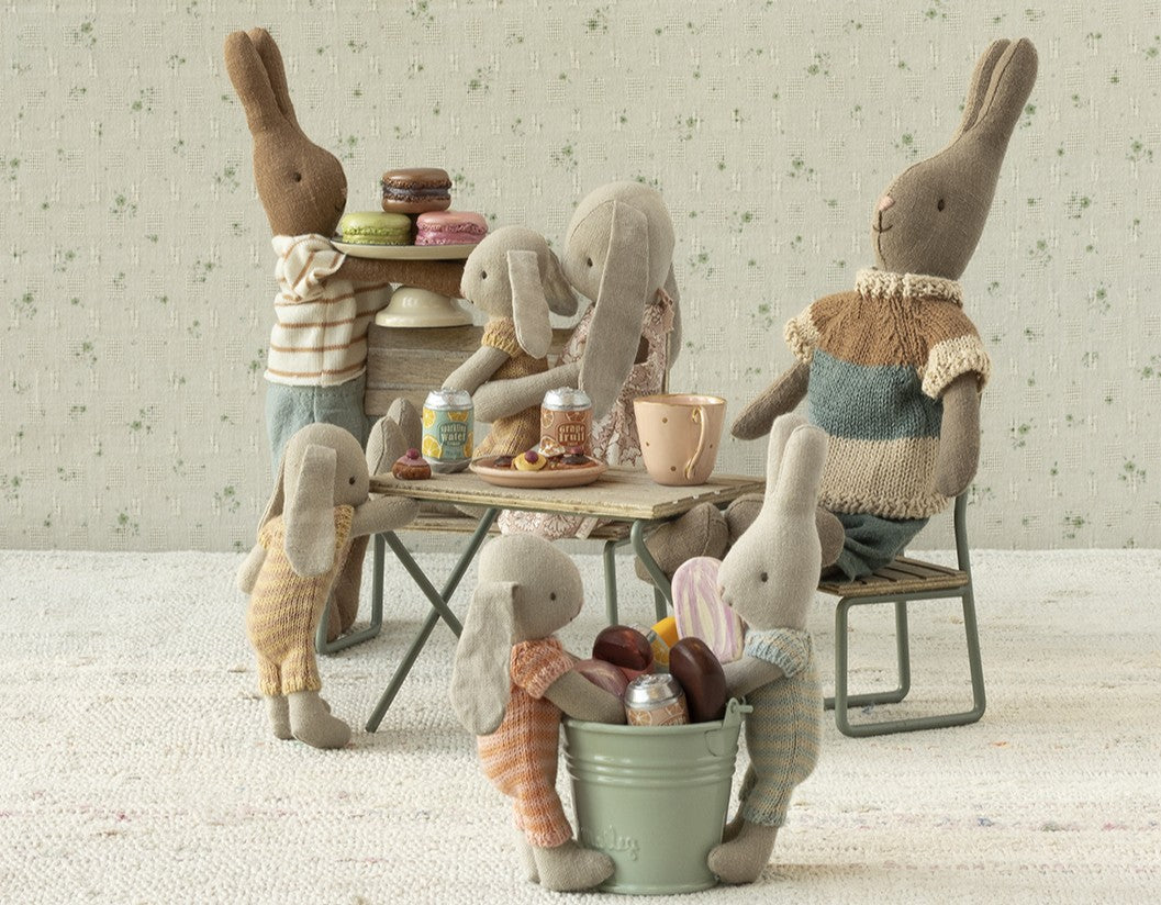 Maileg micro peach bunny tea party scene with Maileg rabbit family around miniature table setting