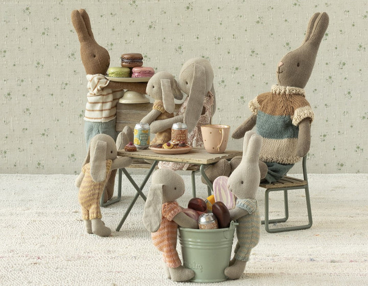 Maileg micro peach bunny tea party scene with Maileg rabbit family around miniature table setting