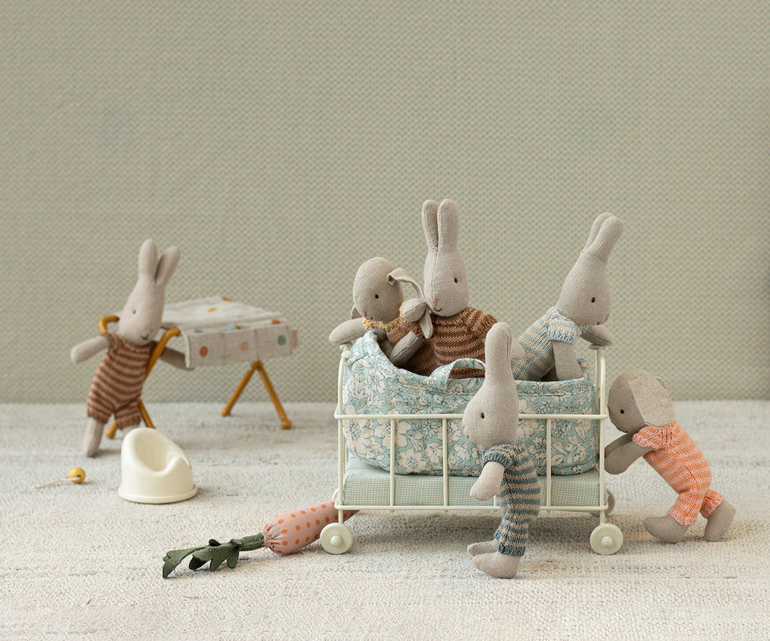 Maileg micro peach bunny lifestyle scene with Maileg rabbit family and wire basket accessories