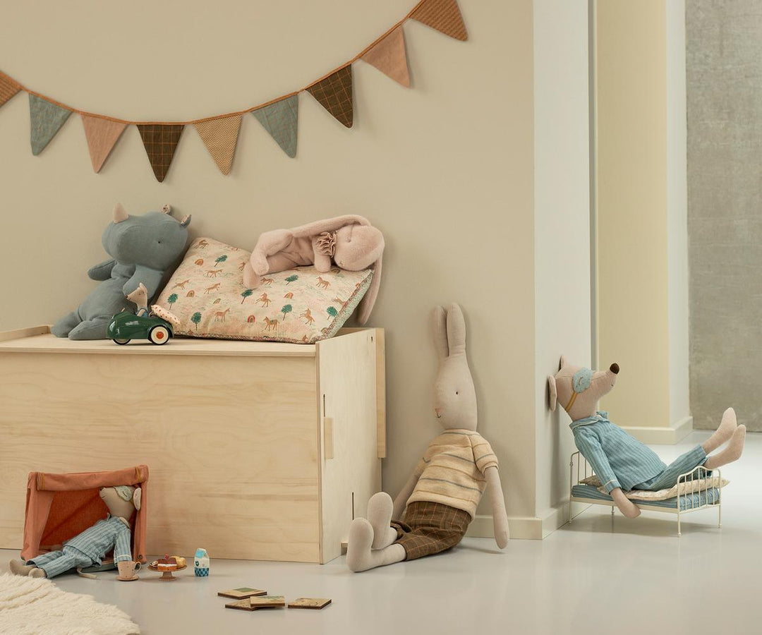 Maileg Sleeping Bunny plush small powder styled in childrenÕs room with Maileg toys and storage