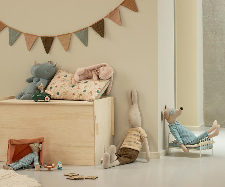 Maileg Sleeping Bunny plush small powder styled in childrenÕs room with Maileg toys and storage