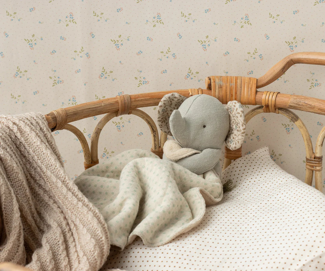 Maileg Mini Elephant Lullaby Friend Iron Grey in nursery – soft musical elephant toy displayed in baby crib setting