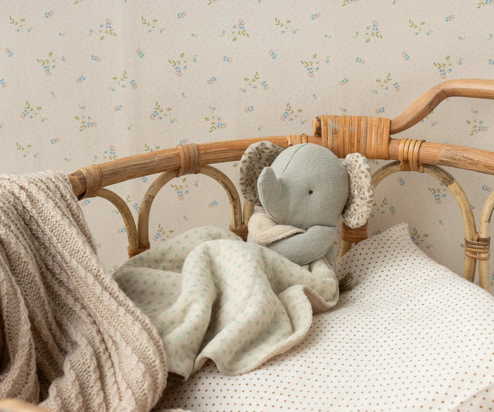 Maileg Mini Elephant Lullaby Friend Iron Grey in nursery – soft musical elephant toy displayed in baby crib setting