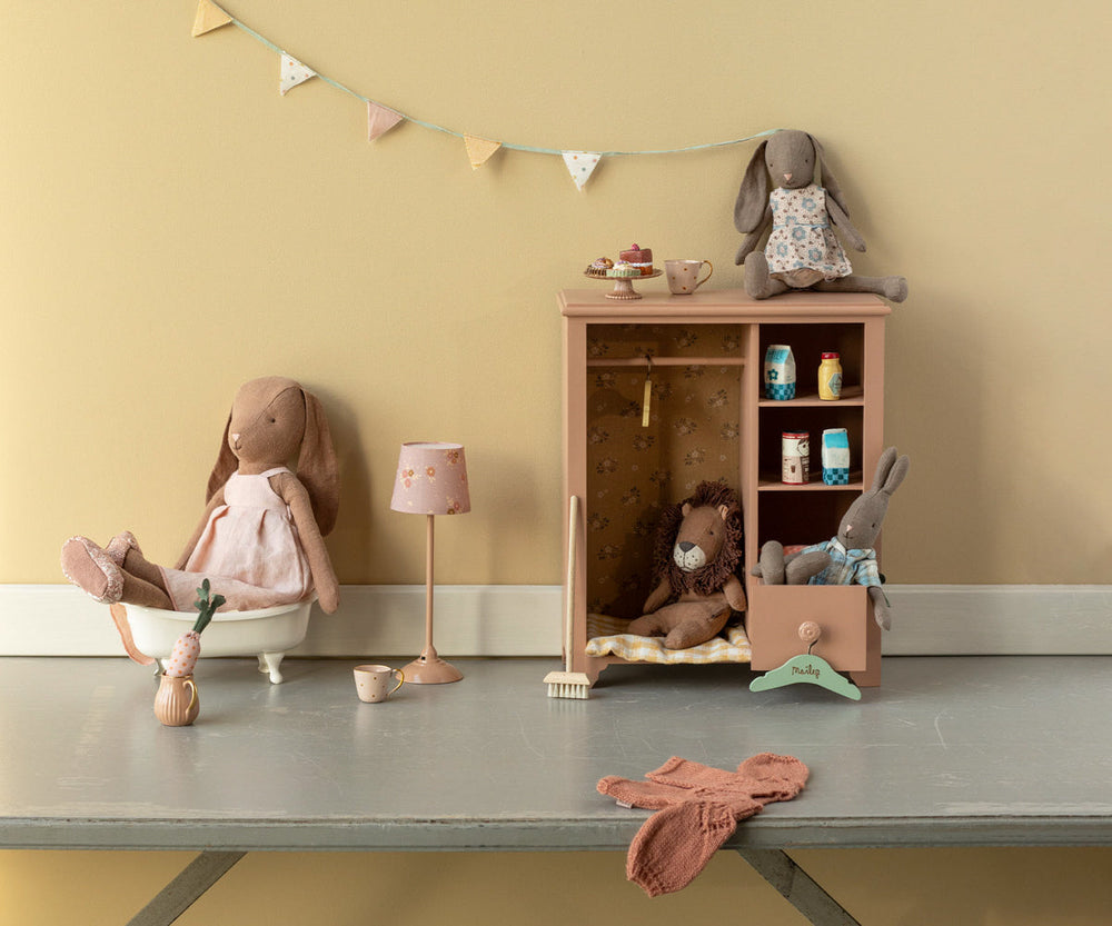 chocolate brown Maileg size 3 bunny in dress lifestyle scene with Maileg wardrobe and accessories