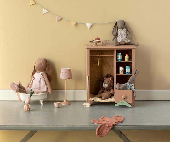 chocolate brown Maileg size 3 bunny in dress lifestyle scene with Maileg wardrobe and accessories