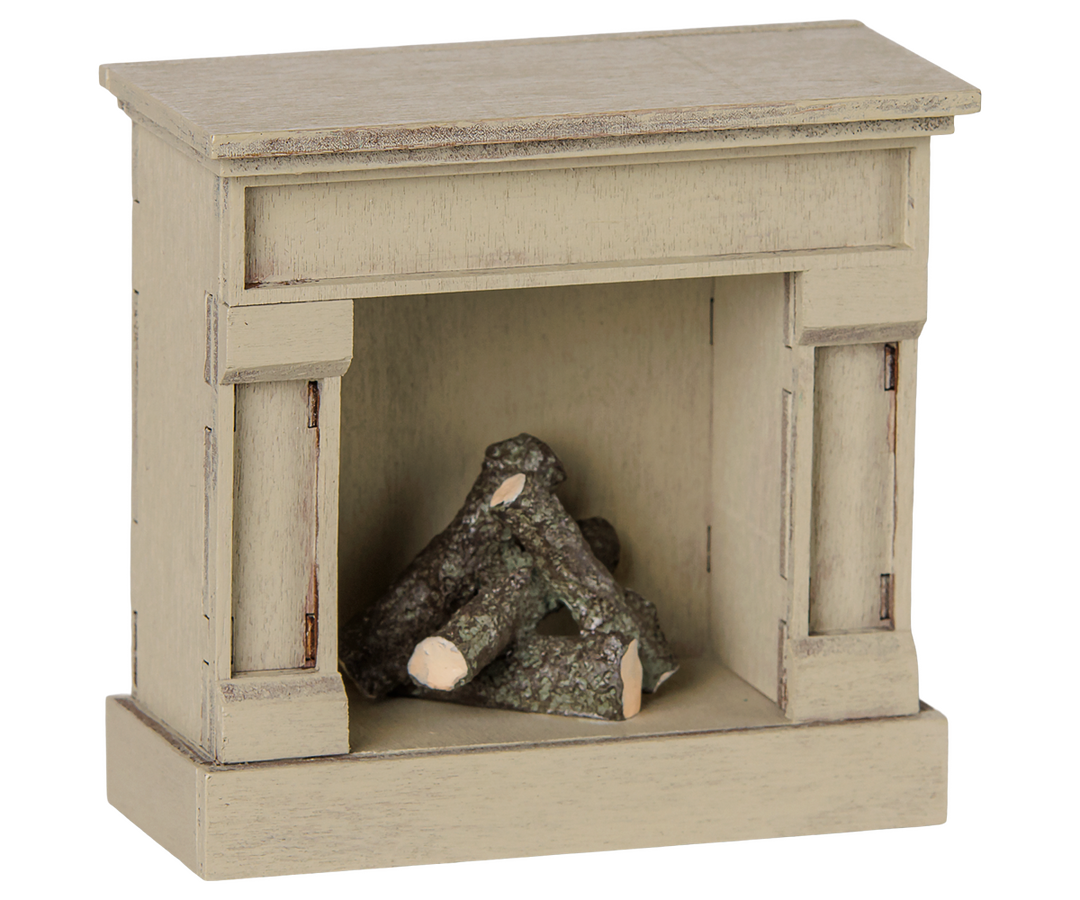 Maileg Mouse Fireplace in Off White glows softly, a cozy piece of Maileg dollhouse furniture