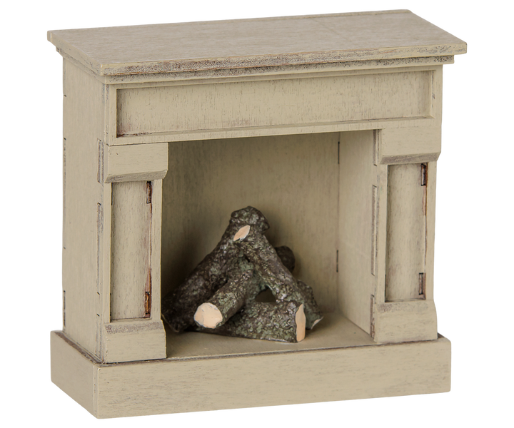 Maileg Mouse Fireplace in Off White glows softly, a cozy piece of Maileg dollhouse furniture