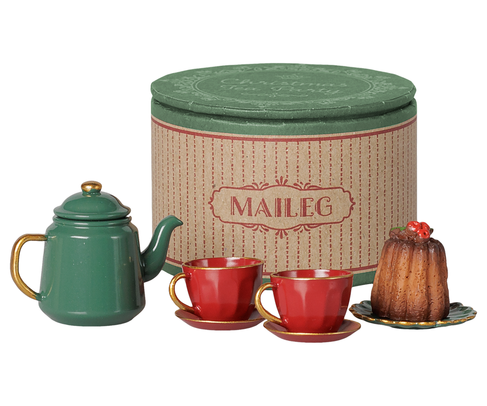 Maileg teapot, cups, and cake beside the Christmas tea party storage box, holiday accessory