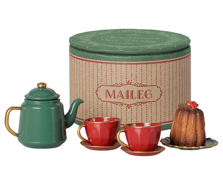 Maileg teapot, cups, and cake beside the Christmas tea party storage box, holiday accessory
