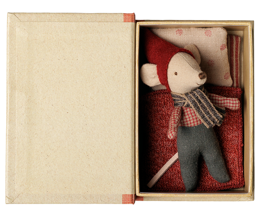 Baby mouse tucked into bed inside this Maileg Christmas storybook, holiday mouse toy