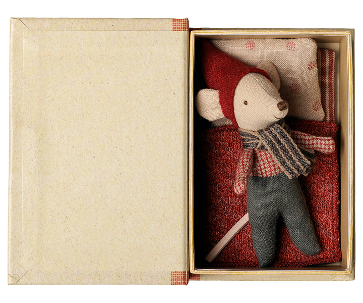 Baby mouse tucked into bed inside this Maileg Christmas storybook, holiday mouse toy