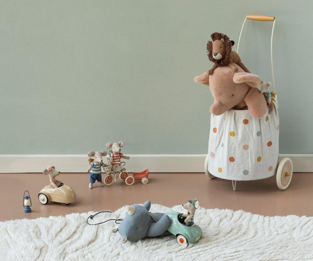 Maileg mouse riding a toy rocking horse, imaginative dollhouse play scene