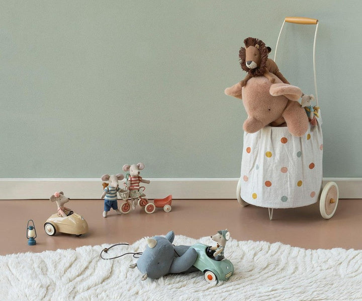 Maileg mouse riding a toy rocking horse, imaginative dollhouse play scene
