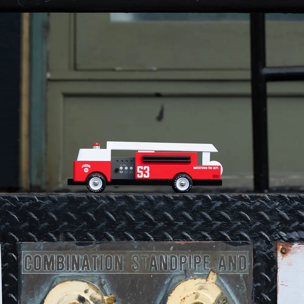 Fire truck toy for toddlers by Candylab, made with natural wood.