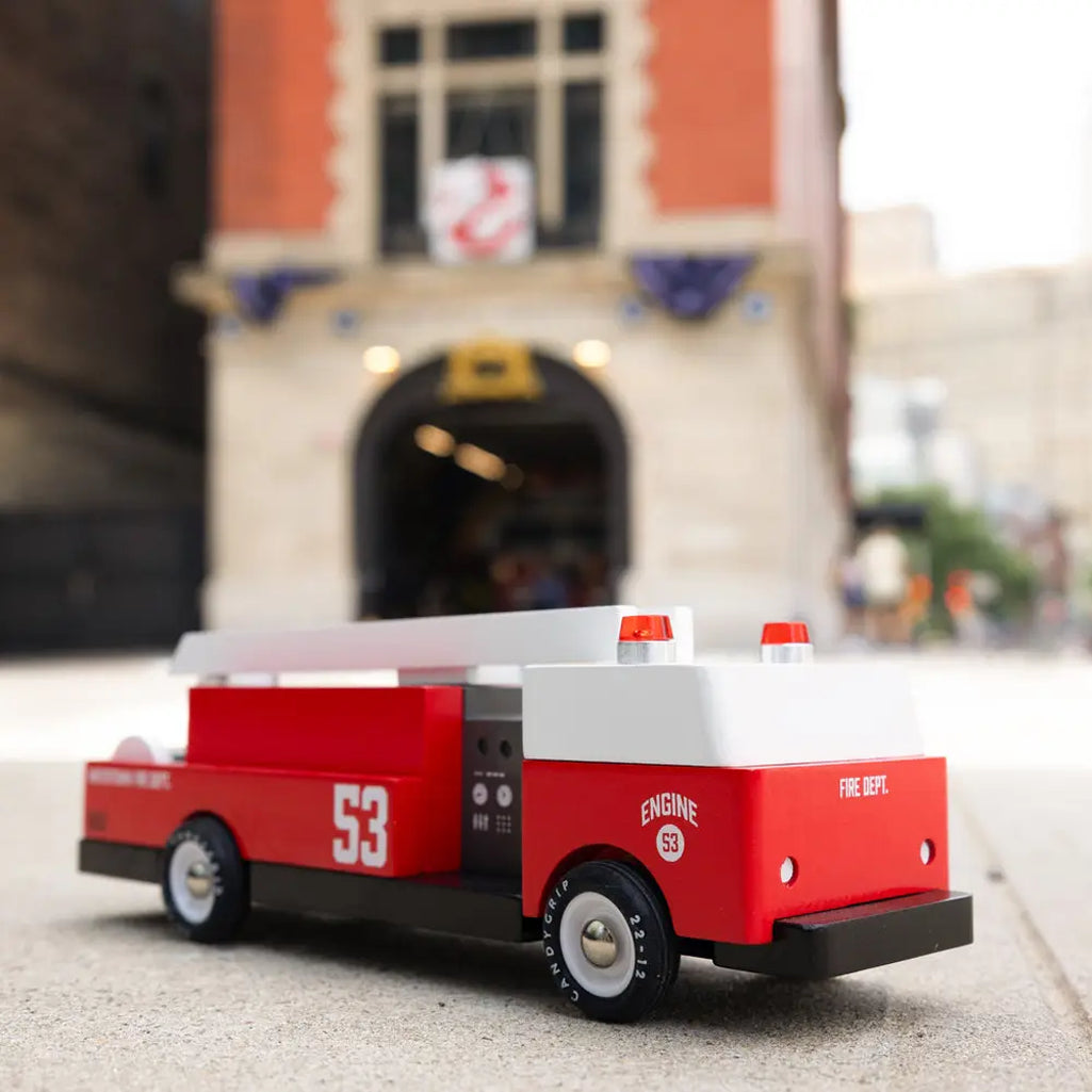 Montessori fire truck toy by Candylab, crafted from sustainable materials.